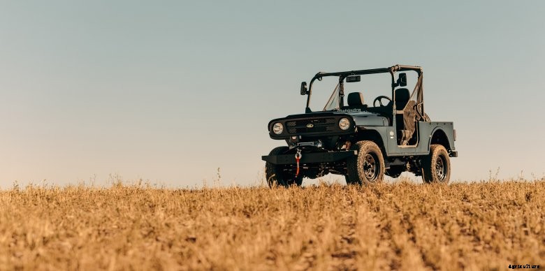 Black Mahindra Roxor sits in a brown field